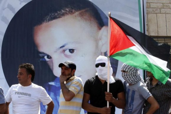 Portrait de Mohammed Abou Khdeir, lors de ses funérailles à Jérusalem-Est, le 4 juillet 2014. Thomas Coex, AFP